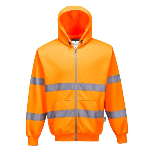 A sárga színű Hi-Vis cipzárós pulóver színe erőteljes kontrasztban áll a városi és ipari környezet szürke-fekete hátterével.