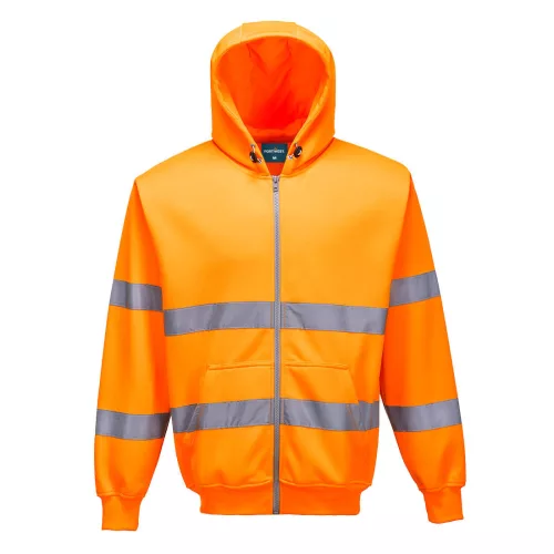 A sárga színű Hi-Vis cipzárós pulóver színe erőteljes kontrasztban áll a városi és ipari környezet szürke-fekete hátterével.